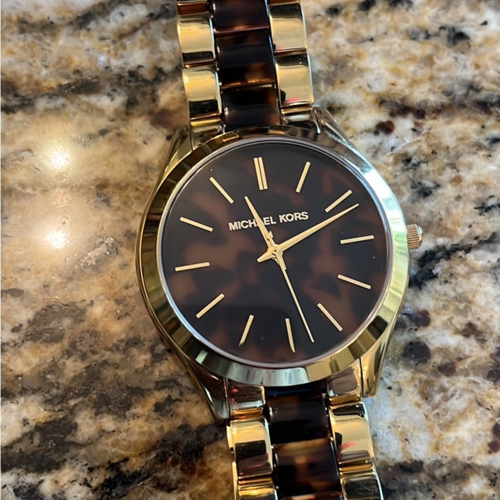 Mk Gold ladies watch with hard case box extra links and watch cushion.